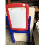 A folding metal table and a childs blackboard/drawing board