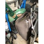 A suitcase and bag containing tent/awning