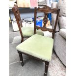 A pair of Edwardian chairs.