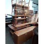 A retro teak extending table and four chairs together with matching sideboard.