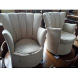 A pair of Art Deco fan back tub chairs.