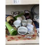 a mixed box of various cups and vases