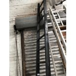 A black painted wooden ladder