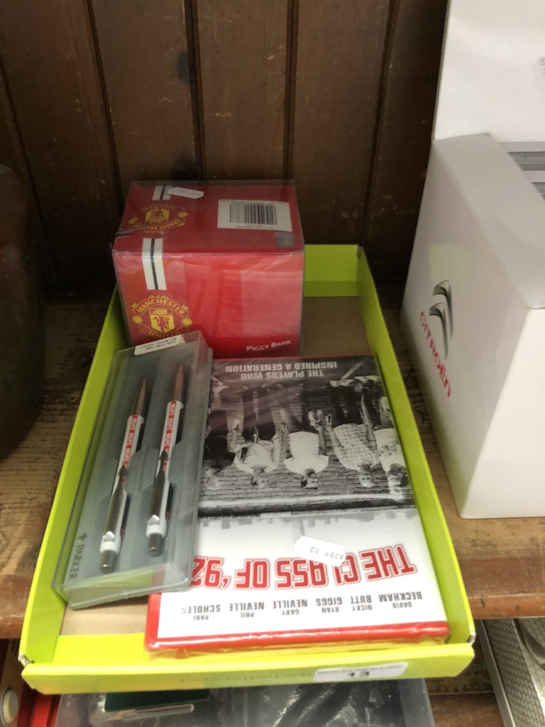 Man United Parker pen set, a Man United piggy bank and a Man United DVD.