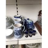 Three vintage jugs, a cheese platter, and modern jug and goblets