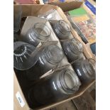 A box of Kilner storage jars and some drinking glasses