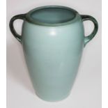 A large green glaze and twin handled pottery vessel, height 37cm.