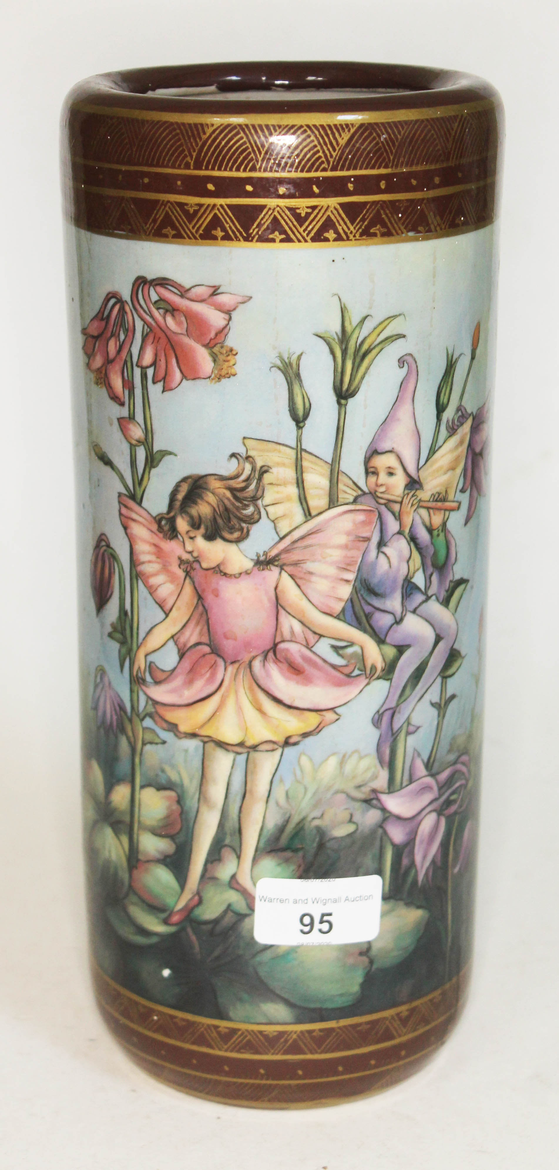 A porcelain vase of cylindrical form with decoration depicting fairies. In good condition, no marks,