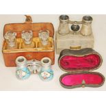 A pair of enamel opera glasses with mother of pearl eye rings, a cased set of three vintage