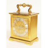 An Imhof solid brass carriage clock with brass face and chapter ring bearing roman numerals,