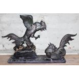 An Art Deco style figure depicting to cast metal fighting cocks on marble plinth, length 74cm.