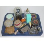 A tray of assorted women's items including five compacts, a Max Factor Electrique scent bottle