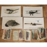 A group of four early aviation postcards and a small collection of cigarette cards..