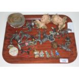 A tray of mixed items including a pair of plaster cherubs, cast metal animals, four Britains