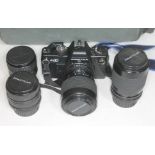 A Praktica BX20 35mm SLR camera with 4 lenses and original Praktica carry bag.