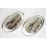 A pair of Edwardian glass paperweights with souvenir seaside scenes.