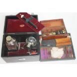 A cased portable lab equipment containing two bottles, pipes, etc. together with a boxed small
