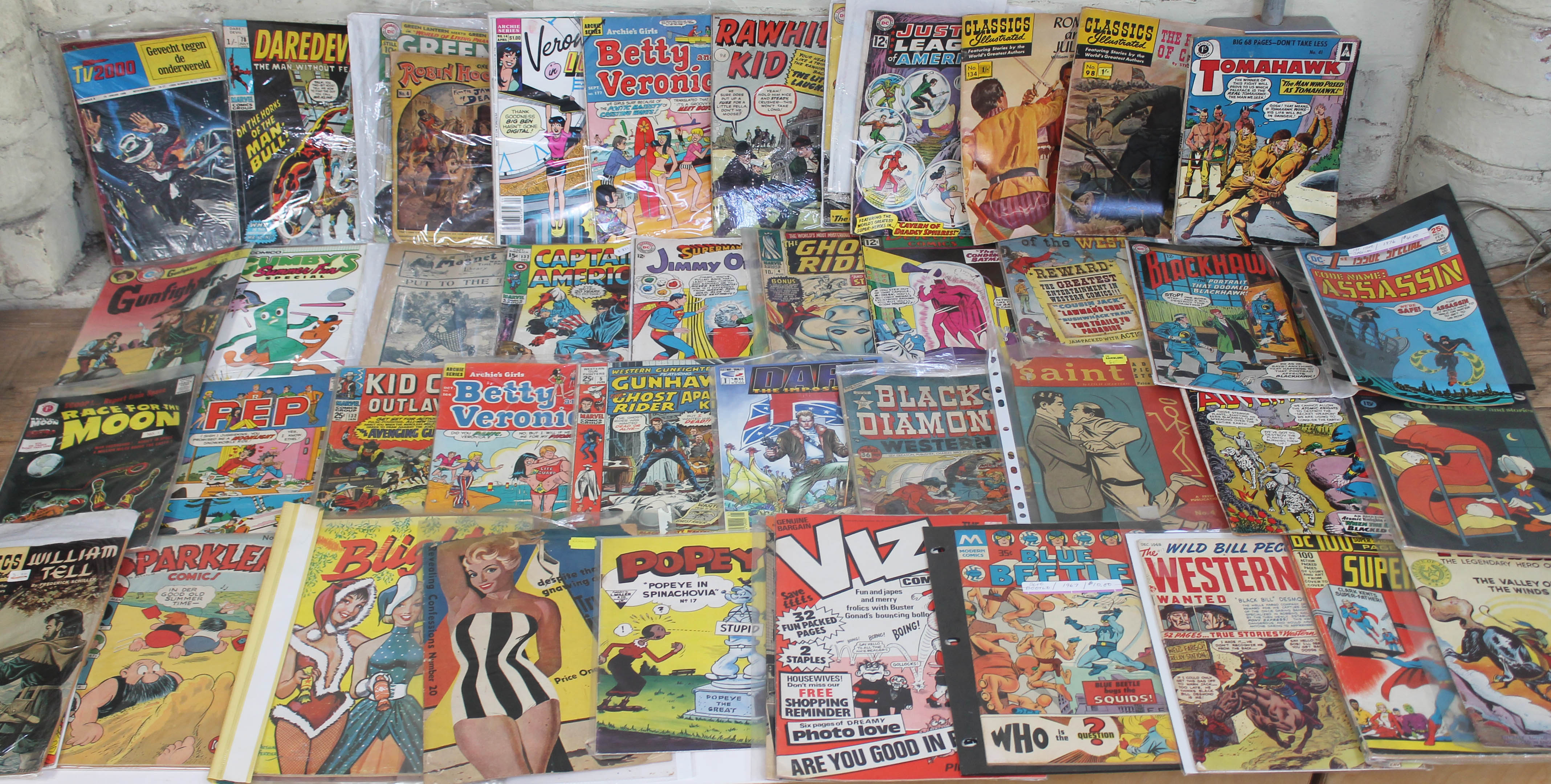 A box of approx 49 vintage comics and magazines including Captain America, DC comics Superboy,