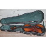 A student violin with bow and hard case.