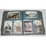 An album containing approx. 300 mainly early 20th century postcards to include sweat heart etc.