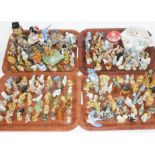 Four trays containing over 220 mainly Wade whimsies and other Wade figures, including Disney figures