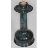 A Royal Doulton stoneware candlestick with domed foot, height 25.5cm. Condition - very good, no