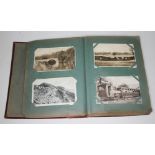 An album containing approx 280 early 20th century postcards.