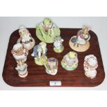 A group of nine Beswick Beatrix Potter figures comprising The Tailor of Gloucester, Appley Dapply,