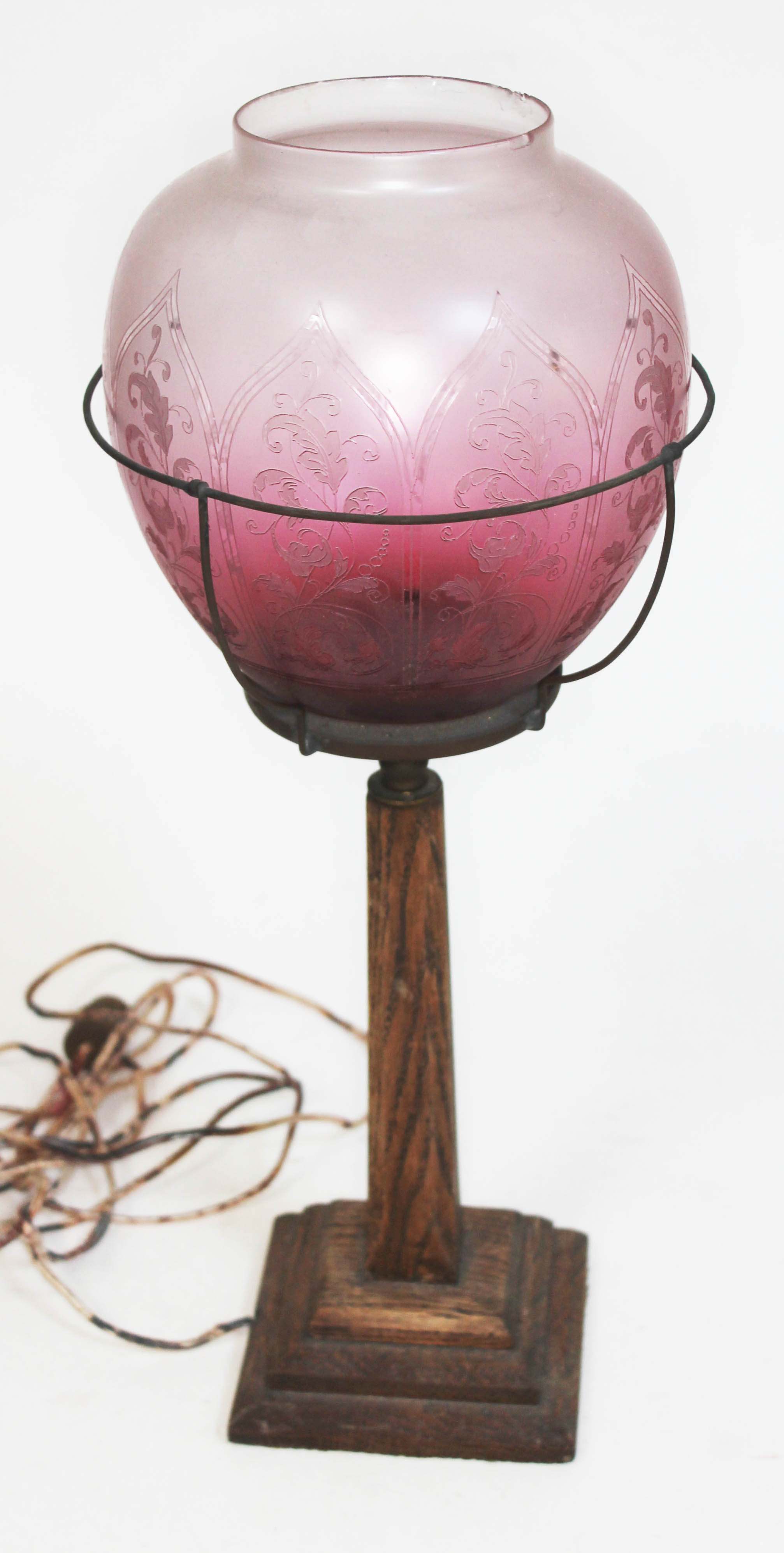 An oak table lamp with etched glass shade, height 47cm.