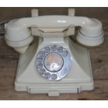 A vintage cream bakelite pyramid telephone with original wire, as found.