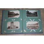 An album containing approx. 150 antique and vintage postcards.