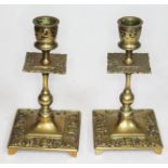 A pair of brass candlesticks, height 15.5cm.
