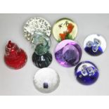 Eight paperweights including Mdina