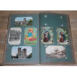 An album containing approx. 175 antique and vintage postcards.