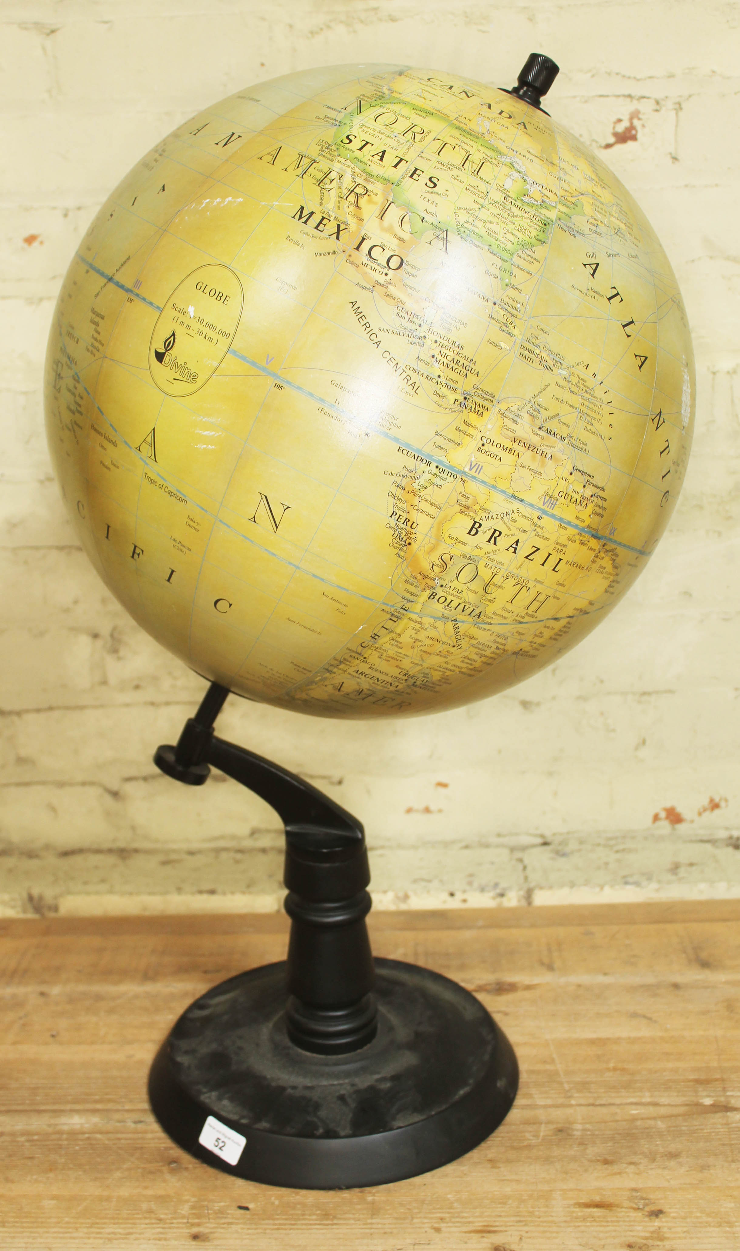 A large Divine terrestrial globe by Divine, height 78cm.