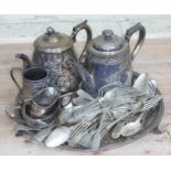 A silver plated tea set and various silver plated cutlery.