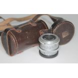 A Taylor Hobson enlarger lens with associated leather case.
