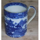 An early 19th century blue and white pottery tankard, height 13.5cm.