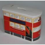 A Carlton Ware money bank formed as a London bus with Guinness advertisement to side, length 15cm.