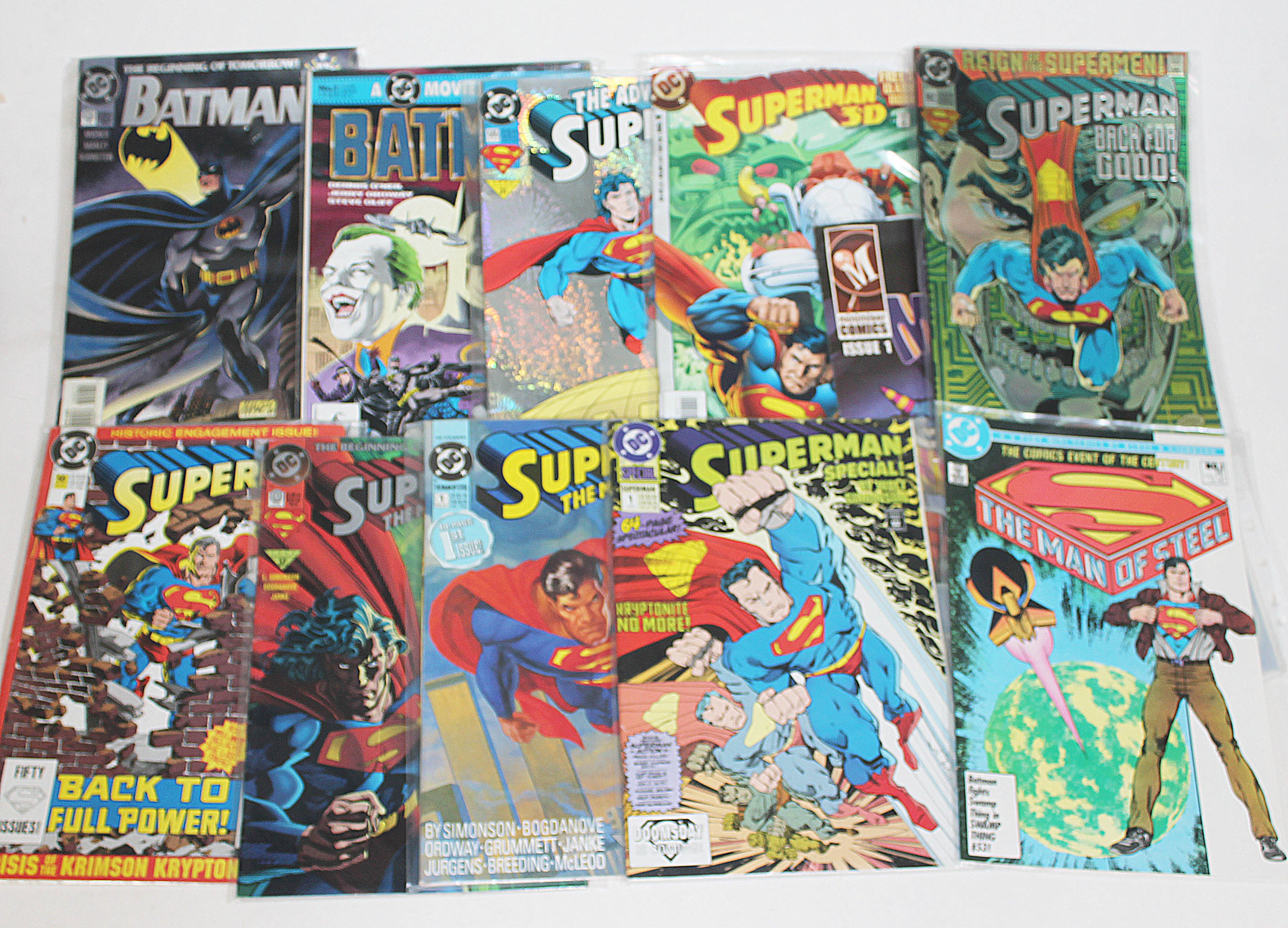 A group of 11 comics, mainly Batman and Superman, circa 1990s.
