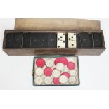 A set of Victorian carved ivory draughts pieces and a set of bone and ebony double nine dominoes