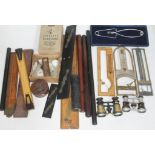 A collection of instruments including rulers, a student's microscope, barometers, together with