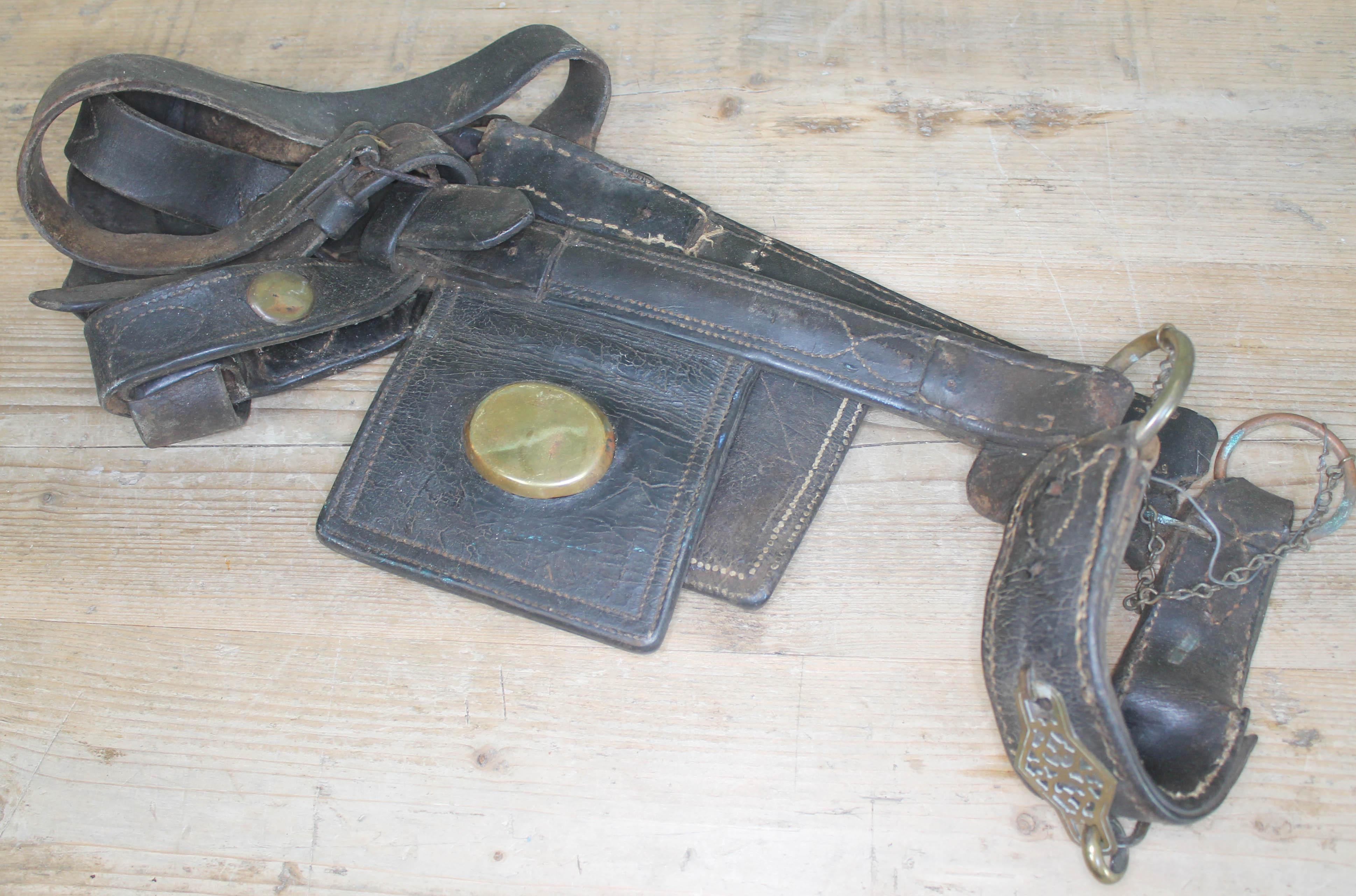 A set of vintage leather horse blinkers.