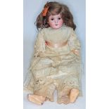 An early 20th century Armand Marseille bisque headed doll with sleepy eyes and open mouth, stamped
