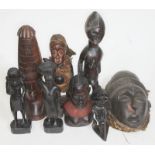 A collection of African tribal masks and figures.