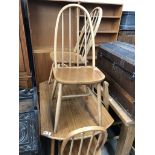 A drop leaf dining table and 4 spindle back chairs
