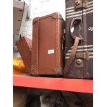 Three vintage travel cases