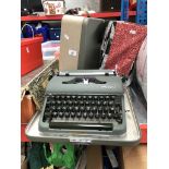A vintage cased Olympia typewriter