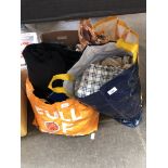 Two bags of material and clothes