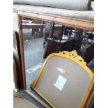 A large pine framed mirror